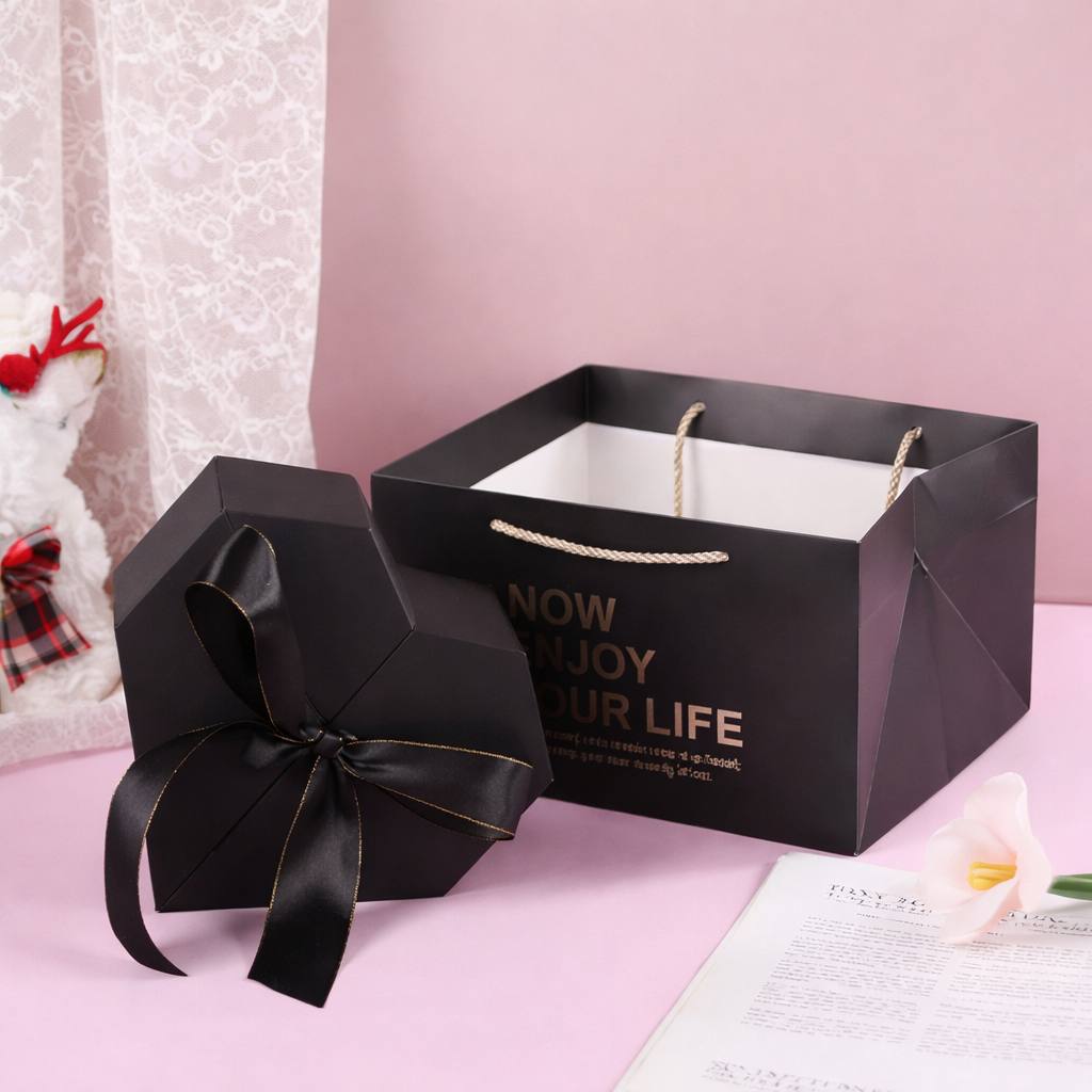 Coffret cadeau noir raffiné prêt à offrir pour la Saint-Valentin. Boîte Cadeau