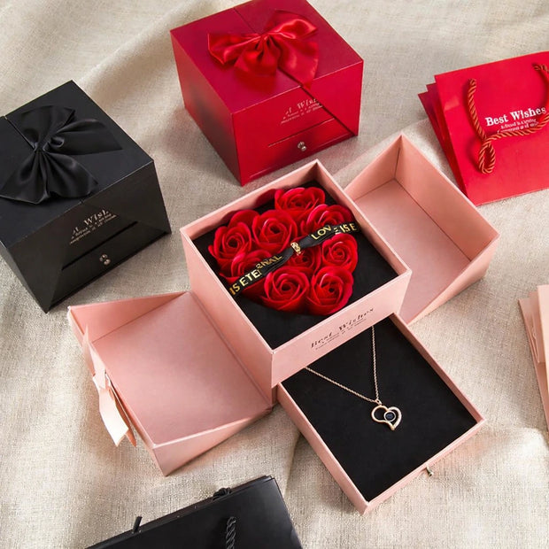 Coffret de roses éternelles rouges avec tiroir contenant un collier. Coffret Roses Éternelles avec Tiroir Surprise